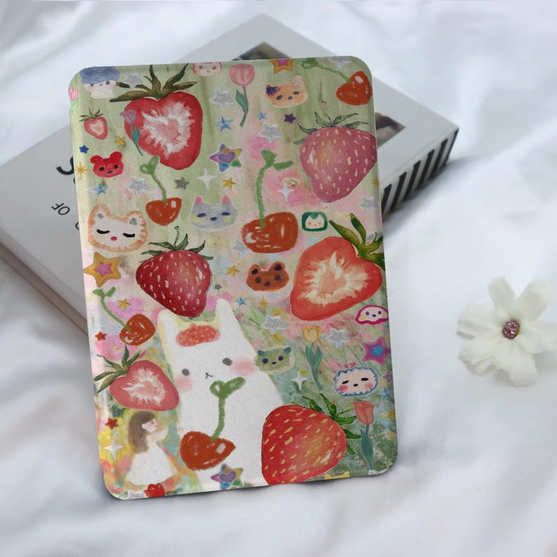 May include: A white phone case featuring a colourful illustration of strawberries, cherries, flowers, and cute animals. The background is a light green and pink watercolour wash.
