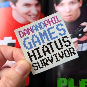 Dan and Phil Games Hiatus Survivor Sticker: Glänzender Laptop Aufkleber