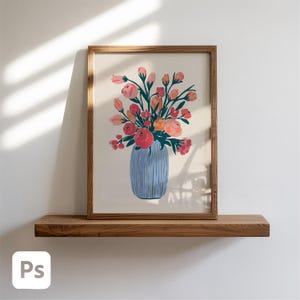 May include: A framed floral art print featuring a bouquet of pink, red, and orange flowers in a blue vase. The artwork is set against a cream background and framed in a wooden frame. The print is displayed on a wooden shelf.