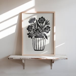 May include: Black and white print of a vase with flowers. The vase is striped and the flowers are stylized.