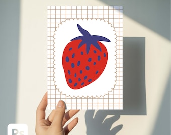 May include: A red strawberry illustration with blue seeds and a blue stem is centered on a white, scalloped-edge shape. The background is a grid pattern. The image is held against a white wall, with shadows.