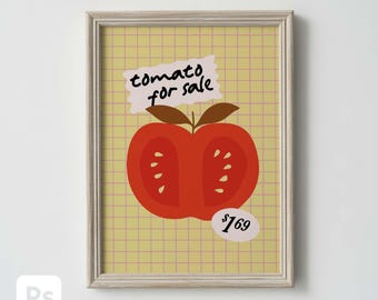 May include: Framed art print featuring a stylized red tomato cut in half, with brown leaves and the text "tomato for sale." The background is a yellow grid pattern. A price tag shows $1.69.
