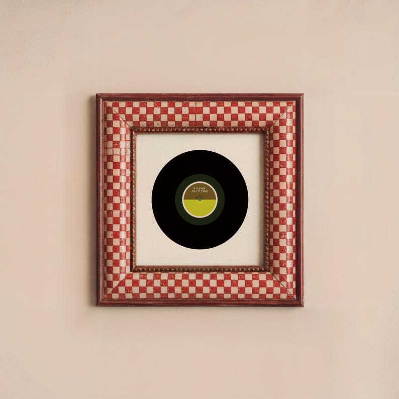 May include: A framed vinyl record with a black and green label. The label has the text "It's Time" and "Patty Time" on it. The frame is red and white checkered.