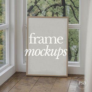 May include: A white frame mockup with the text "frame mockups" in white lettering on a light wood floor.