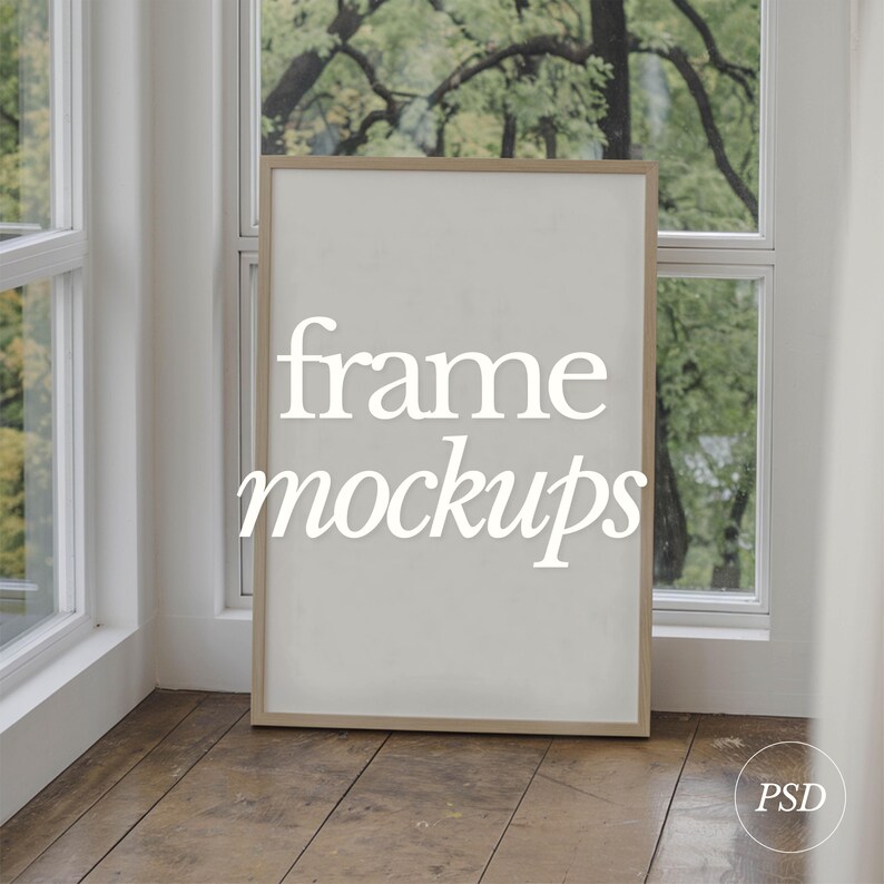 May include: A white frame mockup with the text "frame mockups" in white lettering on a light wood floor.