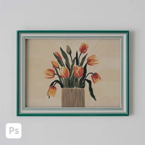 May include: A framed print featuring a bouquet of orange and yellow tulips in a striped vase. The artwork is set against a beige background and framed with a green border. The tulips have green stems and leaves.