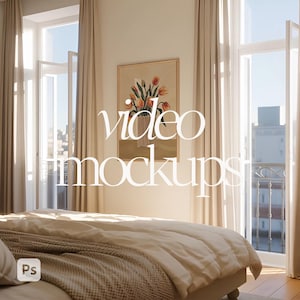 May include: A bedroom interior with a bed, windows, and curtains. A framed floral artwork hangs on the wall. The text "video mockups" is overlaid on the image. The bed is covered with a white comforter and a patterned throw blanket.