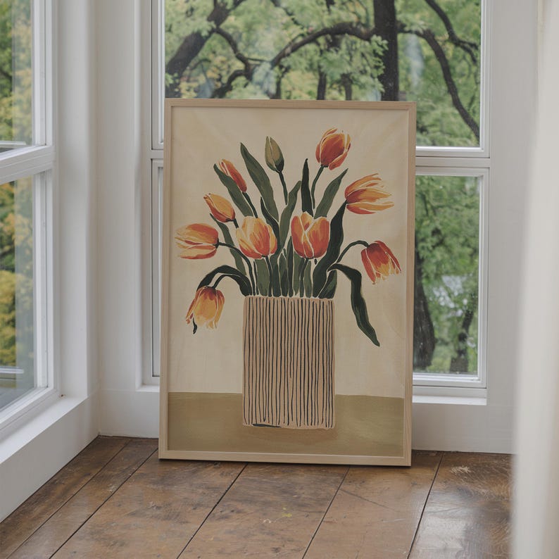 May include: A framed painting of a bouquet of orange and yellow tulips in a striped vase. The background is a light beige color.