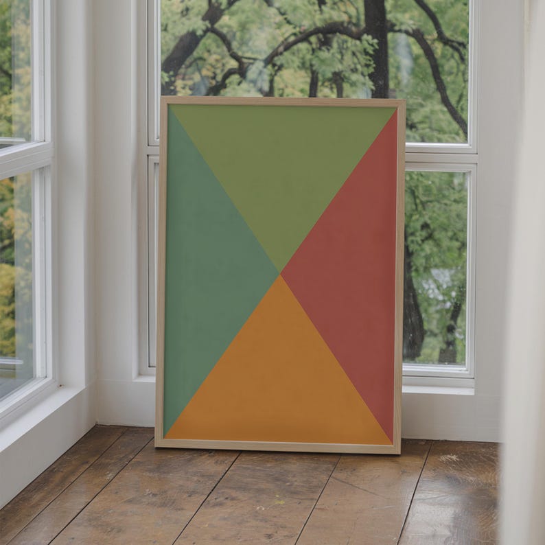 May include: A framed abstract art print with four geometric shapes in shades of green, orange, and red.