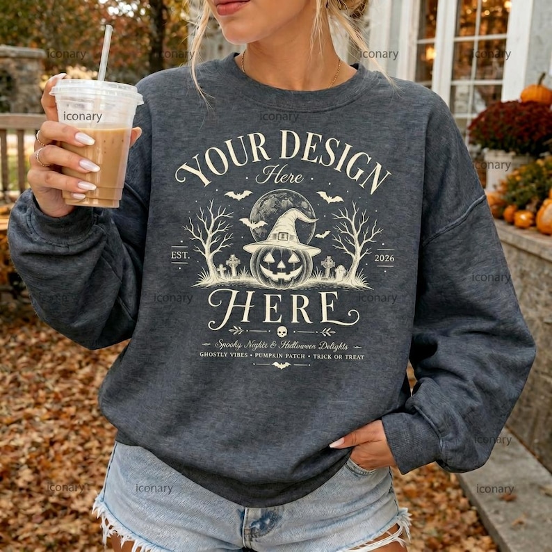 May include: A dark heather gray long-sleeve sweatshirt featuring a white graphic print with the text YOUR DESIGN HERE, a central jack-o'-lantern wearing a witch hat, bare trees, bats, and the text Spooky Nights & Halloween Delights.