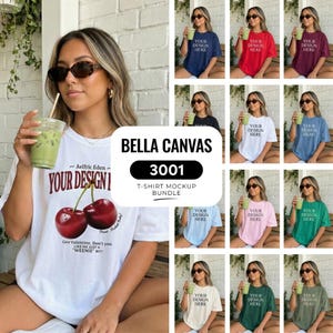May include: A woman wearing a white t-shirt with a cherry graphic and text. The image showcases a Bella Canvas 3001 t-shirt mockup bundle, with various colored t-shirts, each with the text "YOUR DESIGN HERE".