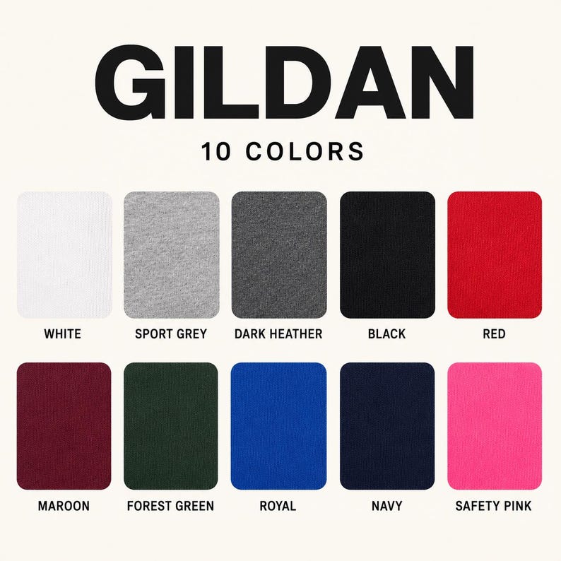 Op de afbeelding: Een Gildan-kleurenkaart met 10 stoffen stalen gelabeld als White, Sport Grey, Dark Heather, Black, Red, Maroon, Forest Green, Royal, Navy en Safety Pink. De tekst GILDAN 10 COLORS staat bovenaan in dikgedrukte zwarte hoofdletters.