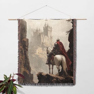 May include: A tapestry featuring a knight on horseback riding towards a large, stone castle in the distance. The knight is wearing a red cloak and the horse is white. The background is a misty, gray landscape.