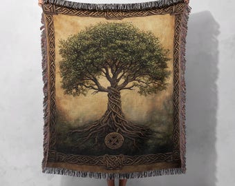 May include: A woven tapestry throw blanket featuring a detailed illustration of a Celtic tree of life with intricate roots and branches. The background is a vintage-inspired parchment with a brown border.