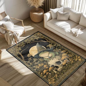 May include: A rectangular area rug featuring a whimsical design. A green frog wearing a wizard hat sits atop a skull, surrounded by foliage, mushrooms, and a full moon. The rug has a dark border and a detailed, illustrated style.