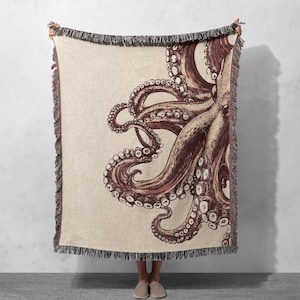 🌿 Nautical Octopus Woven Blanket - Coastal-Themed Throw with Intricate Tentacle Design for Ocean-Inspired Home Decor 🌿
This unique woven blanket features a stunning octopus design in earthy tones, adding a touch of coastal charm to any living space. Perfect for ocean lovers, it’s soft, stylish, and cozy, making it ideal for home decor or as a thoughtful gift.