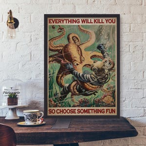 May include: Framed vintage-style poster with the text "EVERYTHING WILL KILL YOU SO CHOOSE SOMETHING FUN." The artwork depicts a diver in a vintage diving suit fighting a giant octopus underwater. The octopus is brown and the diver is in a blue suit.