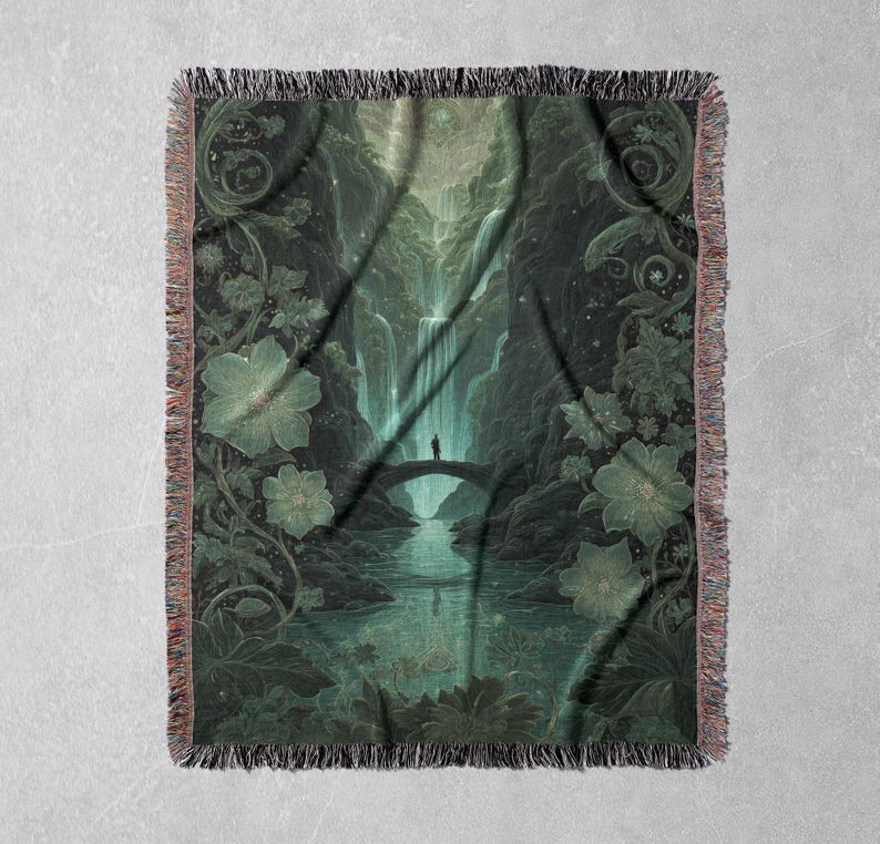 May include: A woven throw blanket featuring a detailed illustration of a serene landscape with a waterfall, bridge, and person. The color palette is dominated by shades of green and teal, with floral and foliage elements. The blanket has a fringed edge.