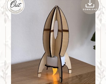 May include: A wooden rocket ship shaped candle holder with a white tea light inside. The rocket ship is made of light brown wood and has a flame coming out of the bottom.