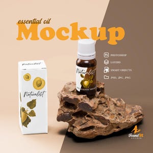May include: A mockup of a white box and a glass bottle with a white cap. The box and bottle have a label with the word "Naturalist" and a drawing of an apricot. The bottle is sitting on a brown rock.