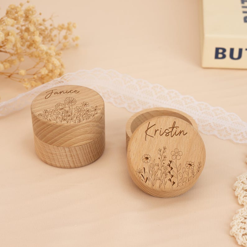 May include: Two small wooden boxes with engraved floral designs and names "Janice" and "Kristin".
