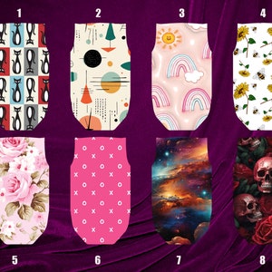 May include: Ten different designs for fabric scraps, each with a unique pattern. The designs include cats, geometric shapes, rainbows, flowers, skulls, and more.