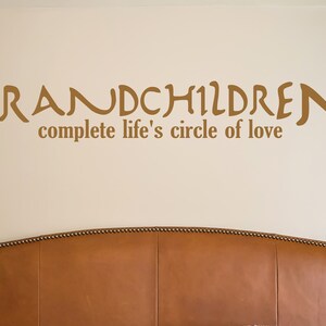 May include: Brown vinyl wall decal with the text "Grandchildren complete life's circle of love".
