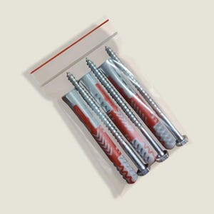 May include: A clear plastic resealable bag containing three metal screws and three matching red and grey plastic wall anchors. The screws have silver-toned heads and threaded shanks, while the anchors feature a textured, ribbed design.