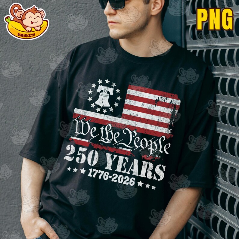 May include: Black t-shirt with a distressed American flag design. The shirt displays the words "We the People" and "250 YEARS 1776-2026", along with a bell and stars, commemorating a significant anniversary.
