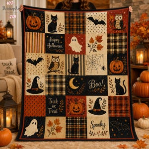 May include: A rectangular Halloween-themed throw blanket featuring a grid of squares with illustrations of pumpkins, black cats, owls, ghosts, bats, witch hats, spiderwebs, and autumn leaves, with text reading Happy Halloween, Boo, Trick or Treat, and Spooky.