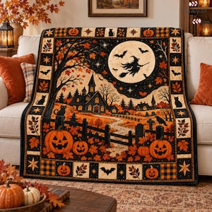 May include: A rectangular throw blanket featuring a Halloween scene with a witch flying on a broomstick against a full moon, a haunted house, jack-o'-lanterns, bats, and black cats. The border displays a pattern of pumpkins, stars, and leaves.