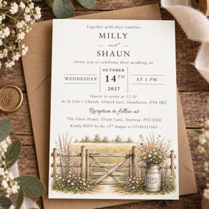 May include: A white wedding invitation card featuring black serif text announcing the marriage of Milly and Shaun on Wednesday, October 14th, 2027. The bottom displays a watercolour illustration of a wooden gate, wildflowers, and a milk can.