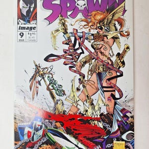May include: A Spawn comic book issue number 9, published by Image Comics in March. The cover features a winged warrior holding a large, ornate spear with flowing ribbons, standing amidst debris, chains, and a shield on a white background.