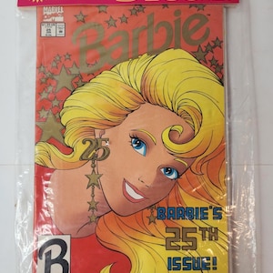 Op de afbeelding: Een verzegelde verpakking met drie Barbie-stripboeken. De bovenste strip toont een blond personage met blauwe ogen, met stervormige oorbellen met het getal 25. De tekst op de cover luidt Barbie's 25th Issue! As Good As Gold! met sterren.