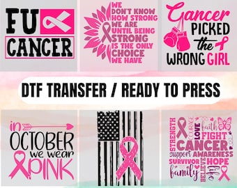 May include: A collection of DTF transfer designs with breast cancer awareness themes. The designs include text and pink ribbons, with phrases like "Cancer picked the wrong girl" and "In October we wear pink." The image also includes the text "70 Design Option."