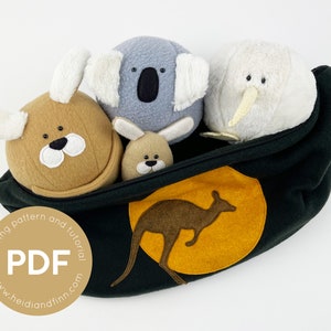 May include: A green zippered pouch with a yellow circle and a brown kangaroo silhouette. The pouch is filled with four plush toys: a brown koala, a grey koala, a white kiwi, and a brown kangaroo.