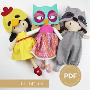 May include: Three 14-inch dolls wearing different costumes. The doll on the left is wearing a yellow dress and a chicken mask. The doll in the middle is wearing a pink dress and an owl mask. The doll on the right is wearing gray overalls and a raccoon mask. The dolls are all standing on a white background.  The text "fits 14" dolls" is at the bottom of the image.
