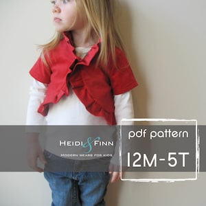 Puede incluir: Un cárdigan rojo con volantes y mangas cortas para niños. El cárdigan se muestra en una modelo infantil. El texto "Heidi & Finn Modern Wears for Kids" y "pdf pattern 12M-5T" se muestra en un rectángulo gris.