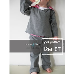 May include: A gray hooded sweatshirt and matching pants for kids, with a pink floral trim. The clothing is designed for children ages 12 months to 5 years. The image includes the text "pdf pattern" and "12M-5T".