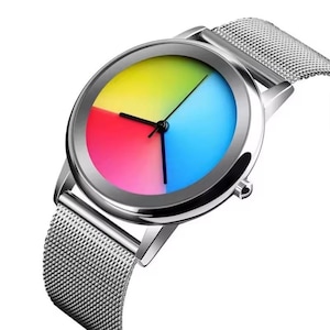 May include: A silver wristwatch with a mesh band and a colorful face. The watch face is divided into four sections of red, yellow, blue, and green. The watch has black hands and a silver bezel.