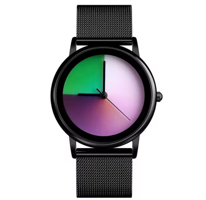 May include: A black wristwatch with a round face featuring a color gradient of green, purple, and white. The watch has a black mesh band and a black bezel. The hands are black and show the time.