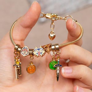 Legend of Zelda Christmas Charm Bracelet Enamel Gold Plated Jewelry with Triforce Master Sword Holiday Gift for Nintendo Fans LoZ TotK BotW
