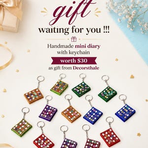 May include: A collection of thirteen handmade mini diary keychains in various colors including red, blue, green, purple, and brown. Each rectangular keychain features a decorative pattern of small mirrors and beads, attached to a silver metal ring.