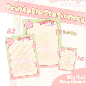 May include: Printable stationery set featuring a cherry blossom theme. The set includes A5, US Letter, and A6 sized paper. Each sheet has a light green border with pink cherry blossom accents and the words "cherry blossom". The words "Printable Stationery" and "Digital Download" are also visible.