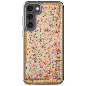 May include: A clear phone case featuring a rectangular design resembling a frosted pastry with colorful sprinkles. The case has a camera module on the left side.