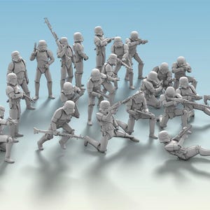 May include: A group of gray Stormtrooper action figures in various poses, some kneeling, some standing, and some aiming their weapons. The figures are set against a light blue gradient background, suggesting a battle scene.