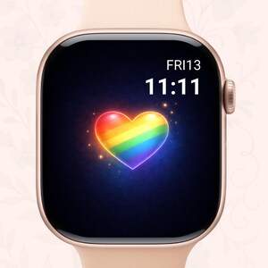 May include: A rose gold smartwatch with a black screen showing the time, date, and a rainbow heart graphic. The screen displays "FRI13" and "11:11" in white text. The heart has a glowing effect.