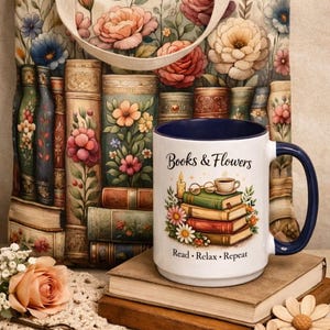 a white mug with a floral design, a stack of books, a tote bag with a floral pattern, and some flowers and a lace doily on a table.