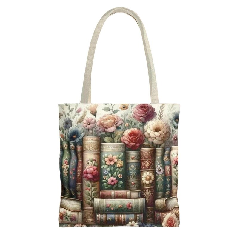 A tote bag with a floral design featuring books and flowers.