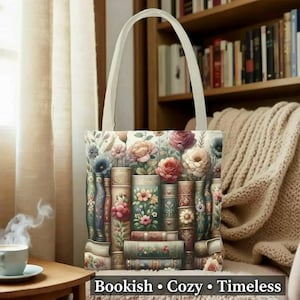 A handbag with a floral design on it, placed on a wooden table in front of a bookshelf filled with books.